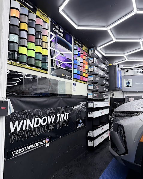 MAIGA's tint shop interior — full inventory of premium ceramic and carbon films